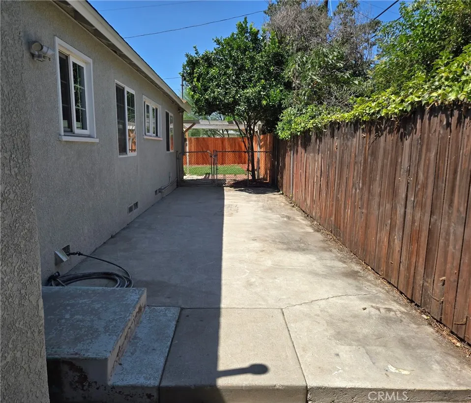 Versatile side yard well suited for pets, storage or a variety of other uses.