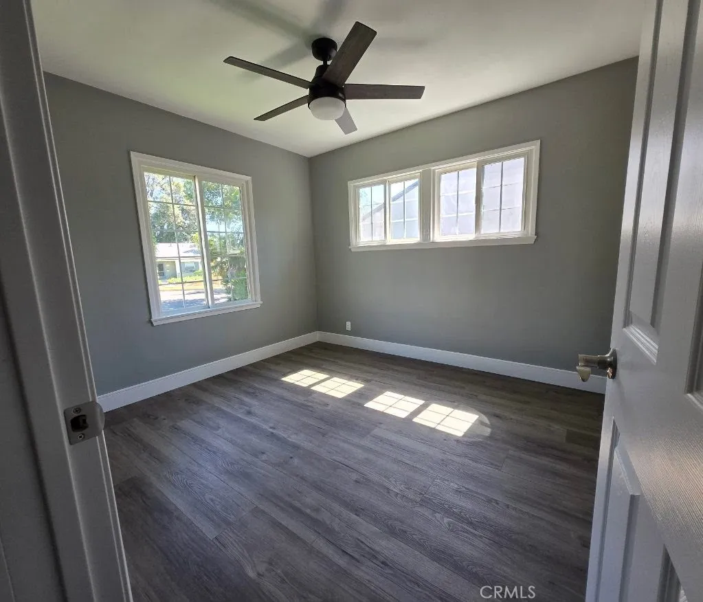 Bedroom 1: Two additional bedrooms provide flexibility for family, guests, a home office, or other changing lifestyle needs, each enhanced with modern ceiling fans for added comfort.
