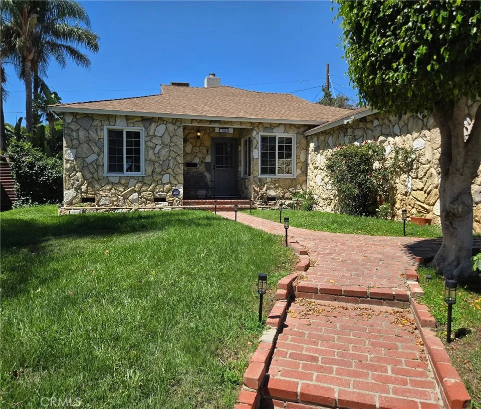 Thoughtfully enhanced curb appeal begins with a brick walkway, pathway lighting, an illuminated address marker, and a welcoming front entry Thoughtfully enhanced curb appeal begins with a brick walkway, pathway lighting, an illuminated address marker, and a welcoming front entry