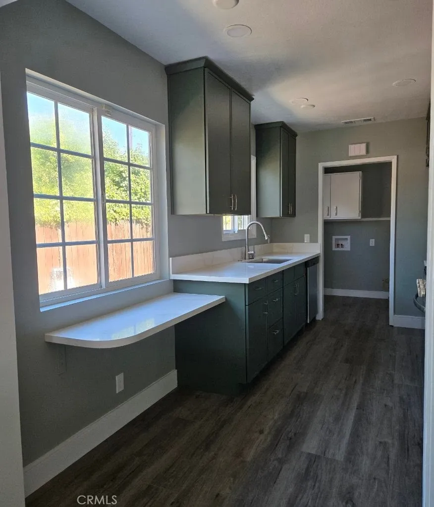 Kitchen offers generous prep space and breakfast  bar