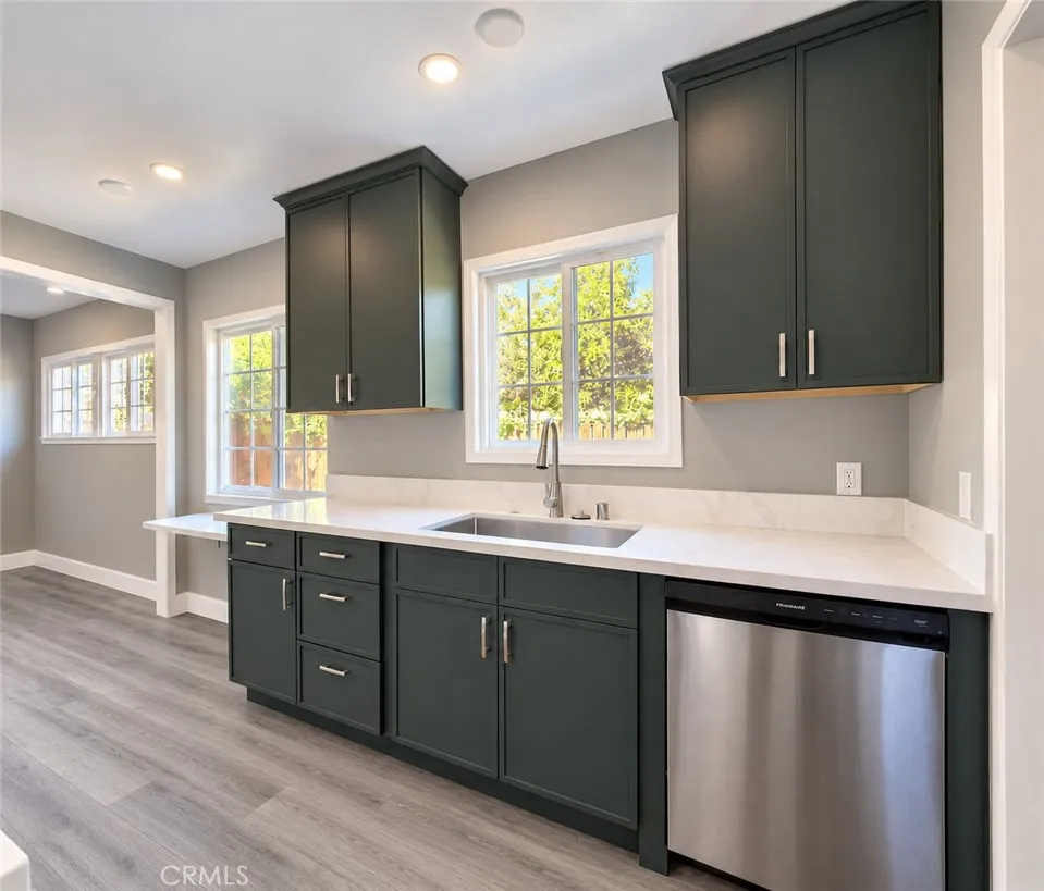 Kitchen boasts elegant quartz countertops Kitchen boasts elegant quartz countertops