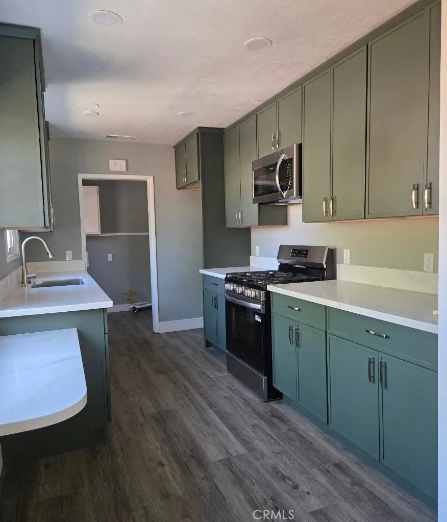 Kitchen features abundant custom cabinetry