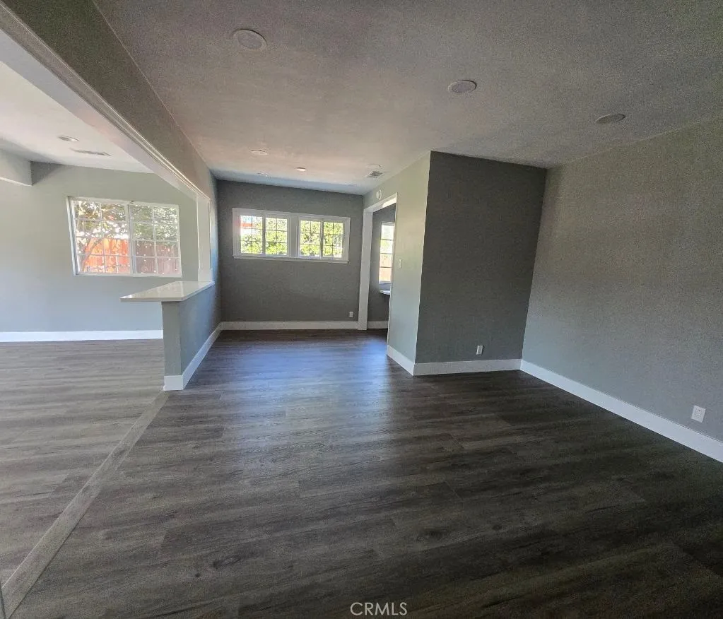 Living room comfortably flows to dining area