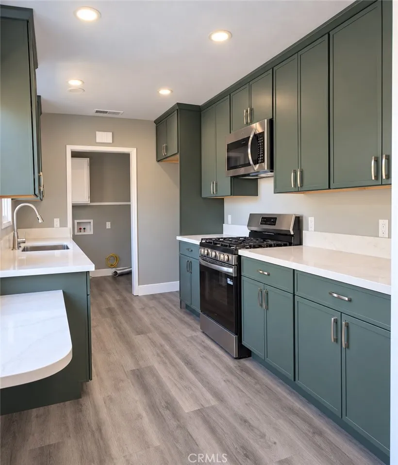 Kitchen features abundant custom cabinetry Kitchen features abundant custom cabinetry