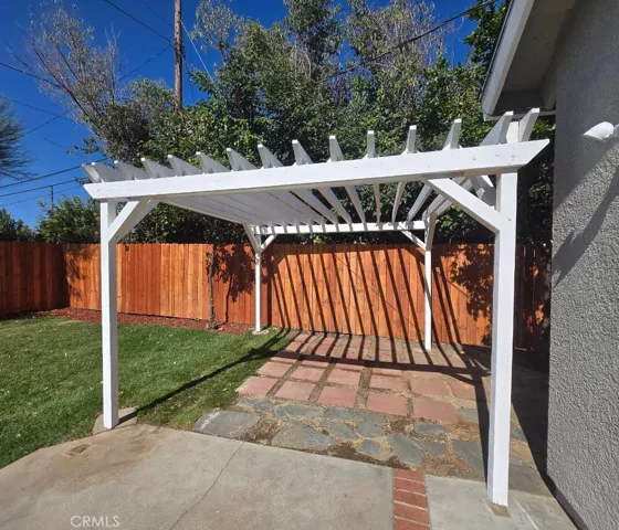 Imagine outdoor dining, comfortable seating, or decorative climbing vines creating your own backyard retreat beneath this charming pergola