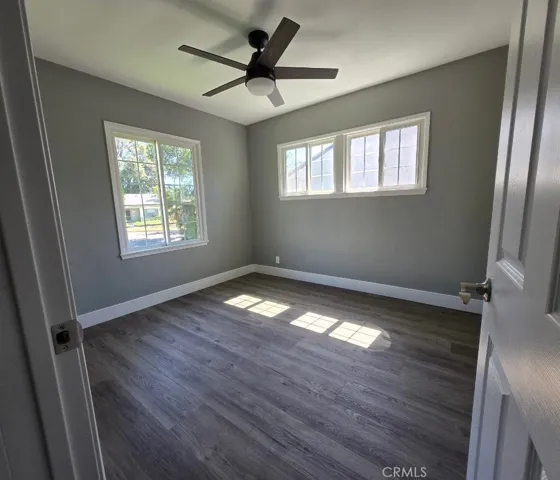 Bedroom 1: Two additional bedrooms provide flexibility for family, guests, a home office, or other changing lifestyle needs, each enhanced with modern ceiling fans for added comfort.
