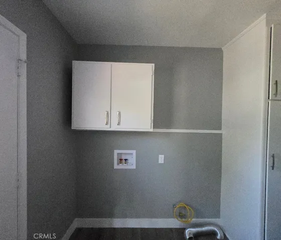 Dedicated laundry room with new laundry hookups