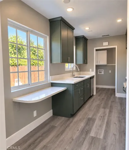 Kitchen offers generous prep space and breakfast  bar