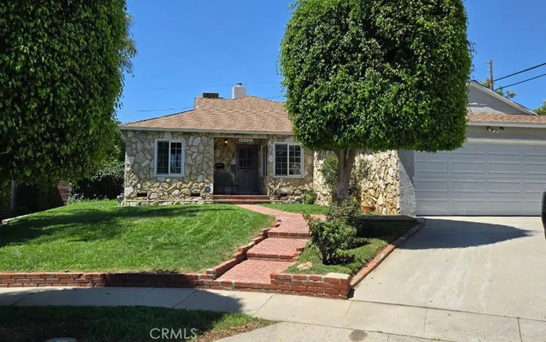 Exterior Facade with quaint brick walkway