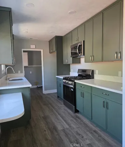 Kitchen features abundant custom cabinetry