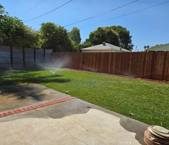 Clean back yard offers ample space for a welcoming blend of open lawn use, outdoor play, fun with pets or adorn it with your trusty grill and patio furniture