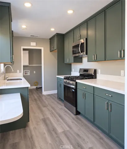 Kitchen features abundant custom cabinetry