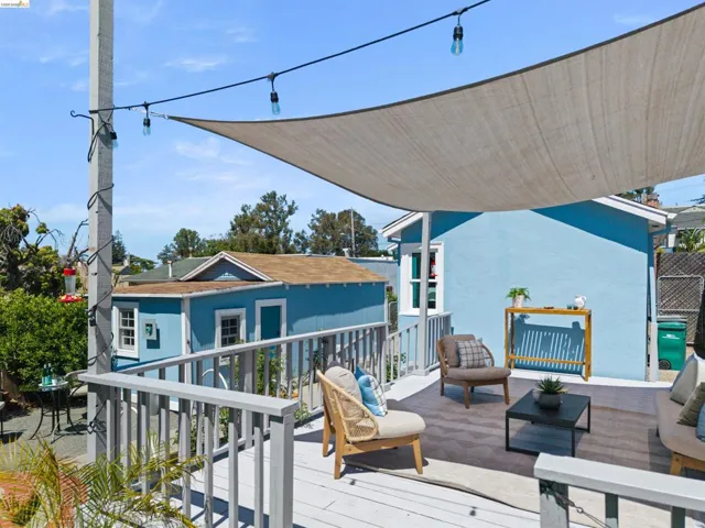 Expansive outdoor deck with a large overhead shade sail