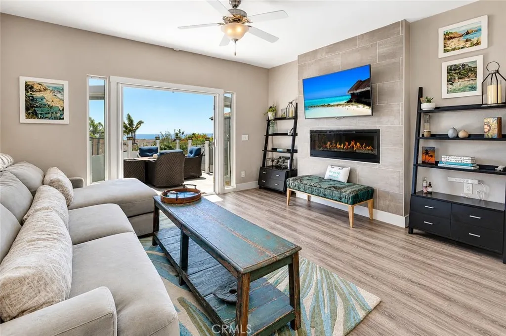 Living room and double doors leading to the oceanview deck