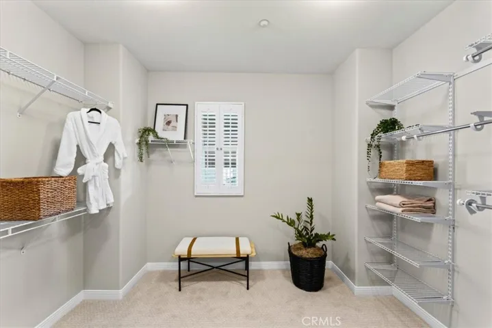 Large walk in closet adjacent to Primary Bedroom Suite