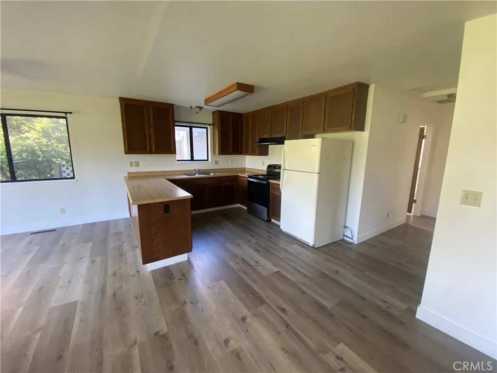 Kitchen open to dining and living areas.