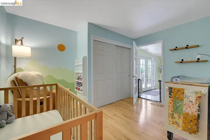Natural wood-finish flooring complements light blue wall tones