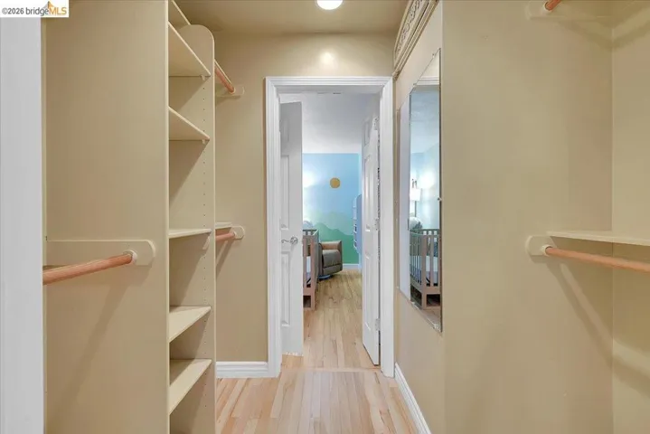Custom closet system featuring multiple shelves and hanging rods