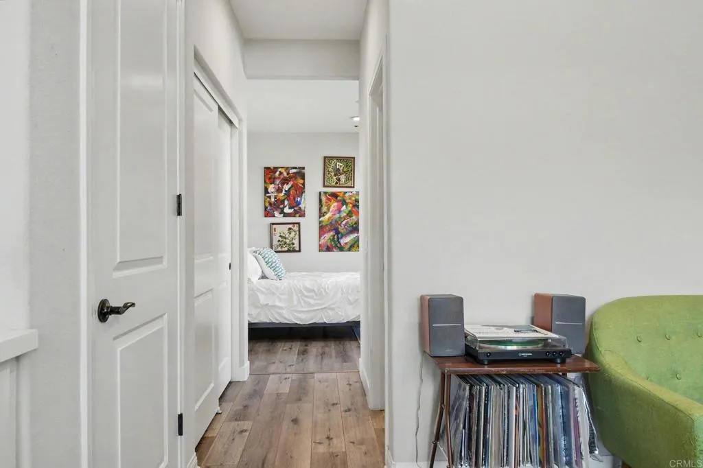 Access to guest bedroom flanked by closet and 3/4 bath