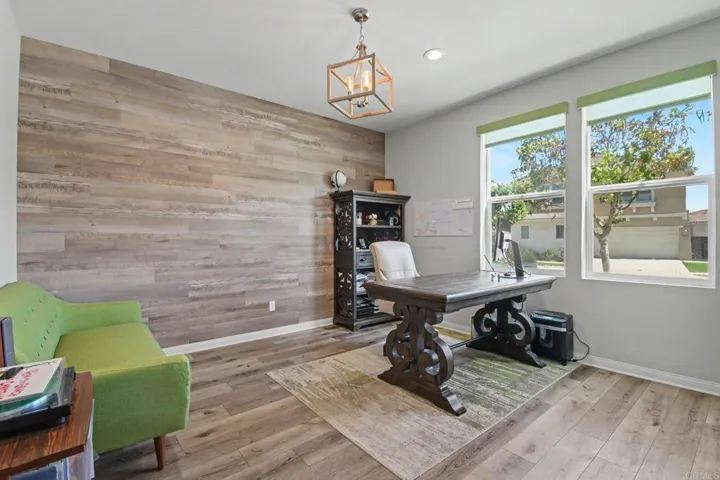 Office, living area for guest suite- or a guest room- just off the hallway at the front entry