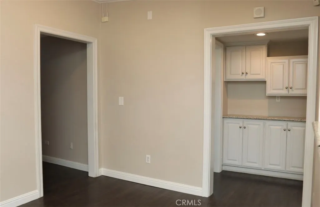 KITCHEN ENTRANCE AND ENTRANCE TO OFFICE'S