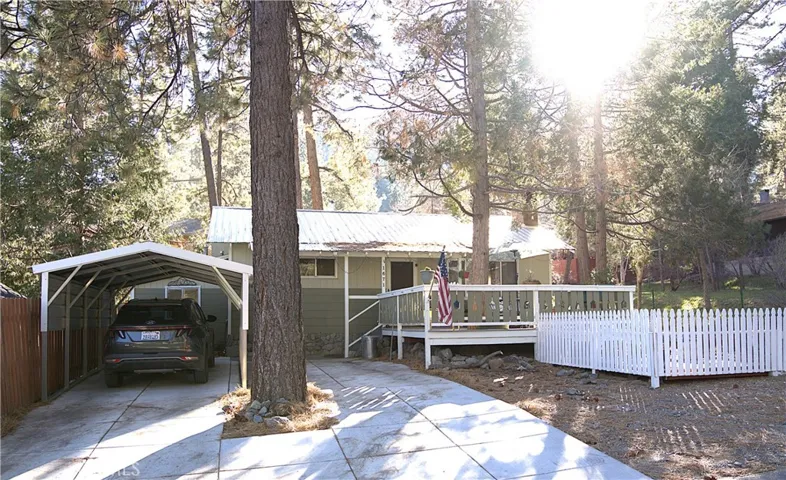 front of house, covered parking, new driveway