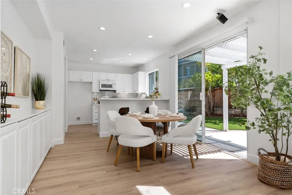 Dining Area: The dining space sits just off the kitchen and opens directly to the patio through wide sliding glass doors, supporting easy indoor-outdoor entertaining.