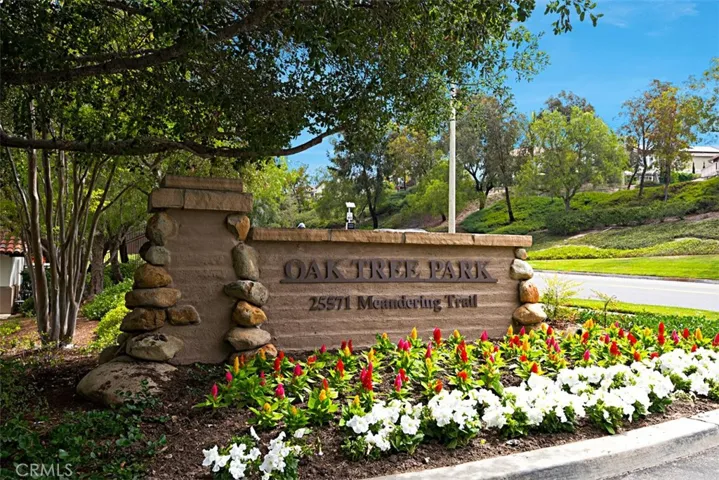 Oaktree Park Entrance: Landscaped monument sign marks the entrance to Oaktree Park along Meandering Trail.