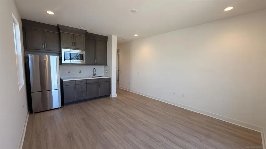 Multi-gen Suite including kitchenette, private bath and walk in closet, with separate entrance and door to the main residence.