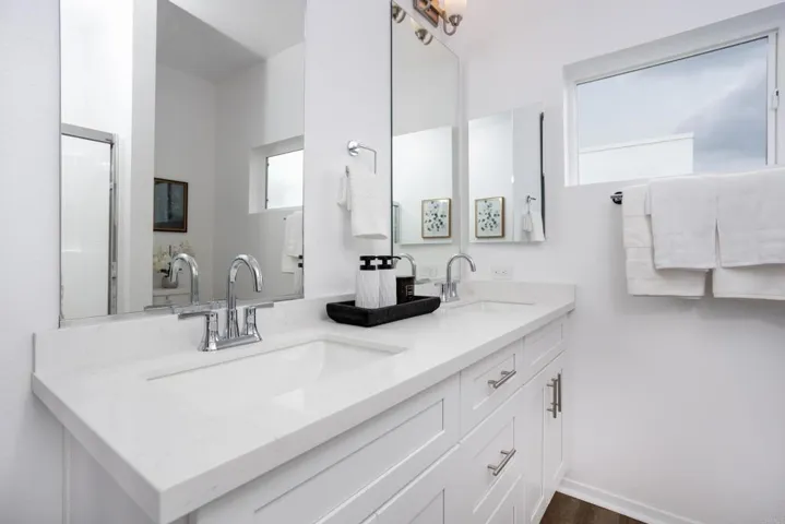 Private en-suite bathroom with dual vanity and contemporary