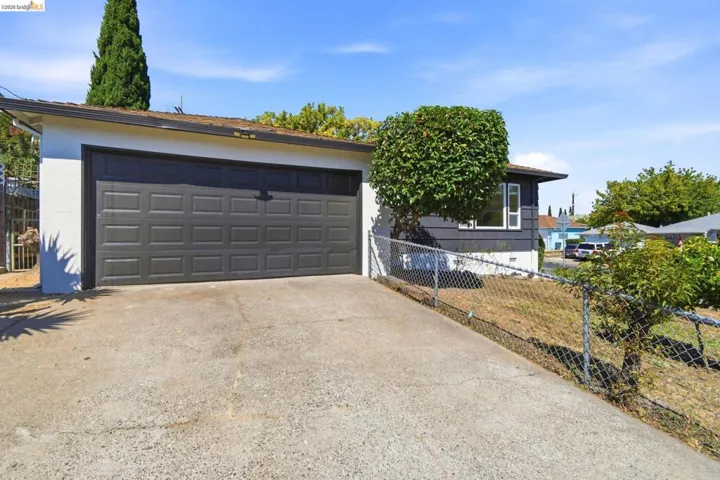 Attached two-car garage with a panel door.