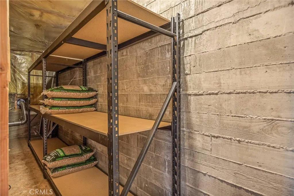 Storage area off of 2nd floor living room with extra pellets included for fireplace.