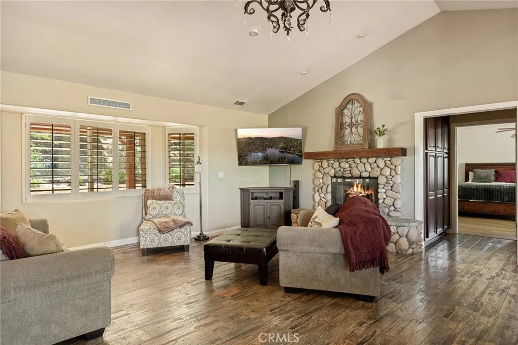 Living room with rock fireplace.