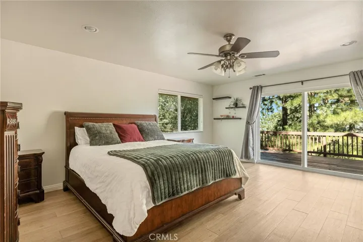 Main level primary bedroom suite.
