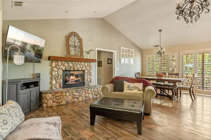 Living room open to dining and kitchen.