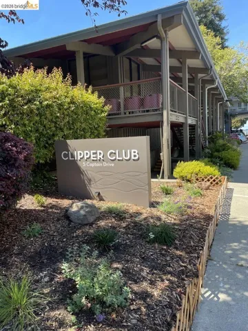 Clipper Club signage with landscaped garden beds