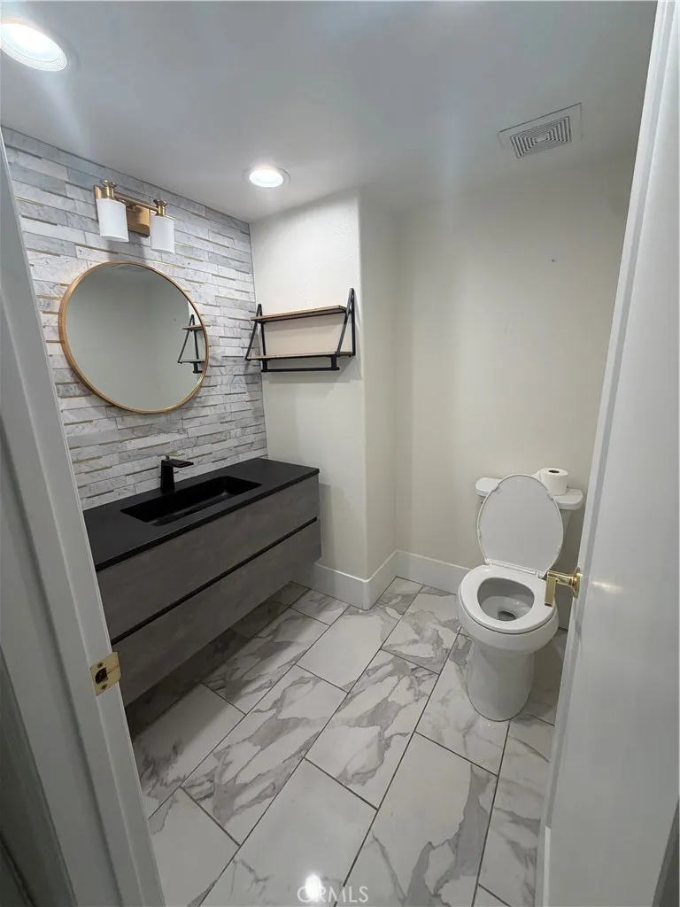 Down stairs​​‌​​​​‌​​‌‌​​‌​​​‌‌​​​‌​​‌‌​​‌‌​​‌‌​​​​ bathroom