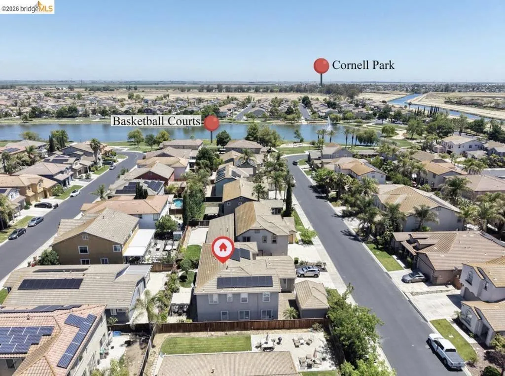 Residential neighborhood with varied rooflines and solar panels on several homes