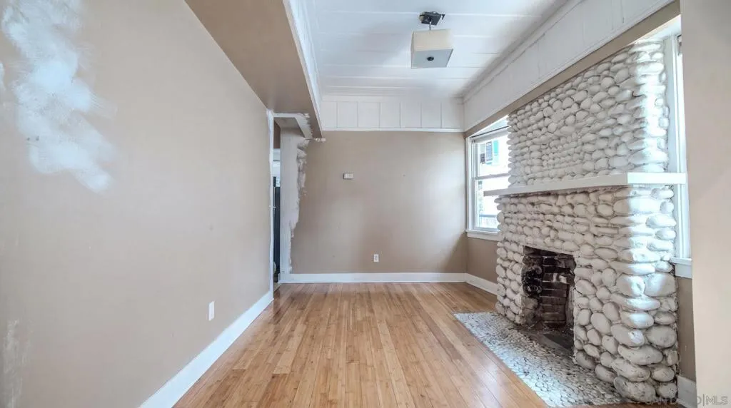 AI/Digitally Altered sitting room- Currently being used as a bedroom by tenant