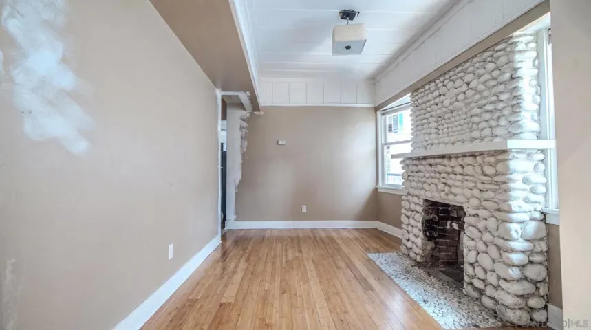 AI/Digitally Altered sitting room- Currently being used as a bedroom by tenant