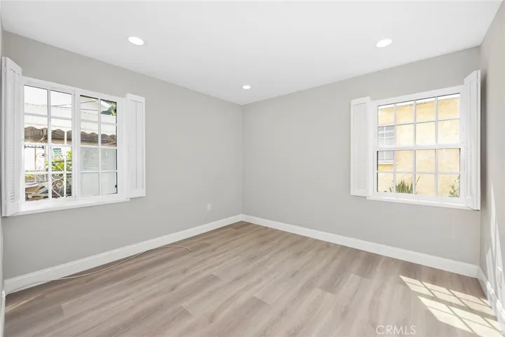 Light and bright bedroom two, newly remodeled. Wood shutters in every room.