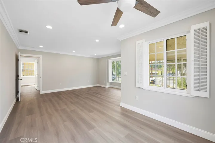 View of the living room and the dining room. Bedrooms and bathroom of house is at the end of the living room.