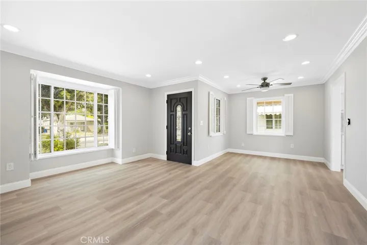 Spacious living room and dining room, filled with lights!
