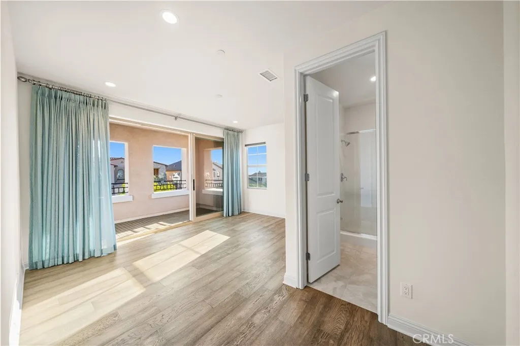 Upstairs bedroom suite with balcony