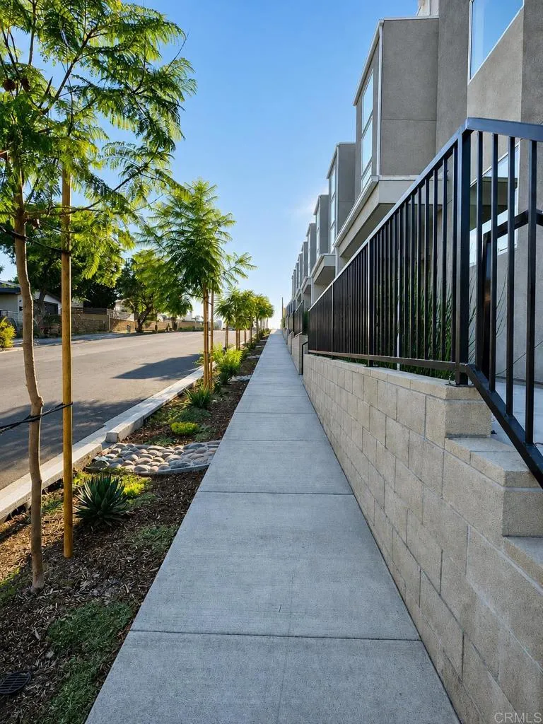 Wide sidewalks and contemporary architecture throughout the community.