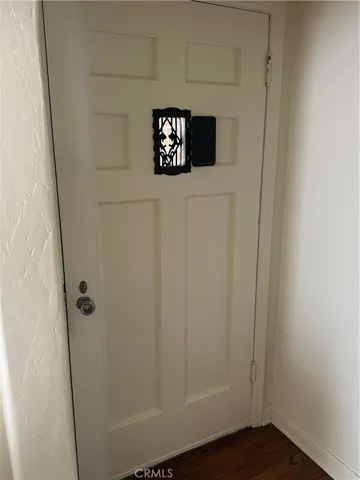 Front door with peep hole that closes
