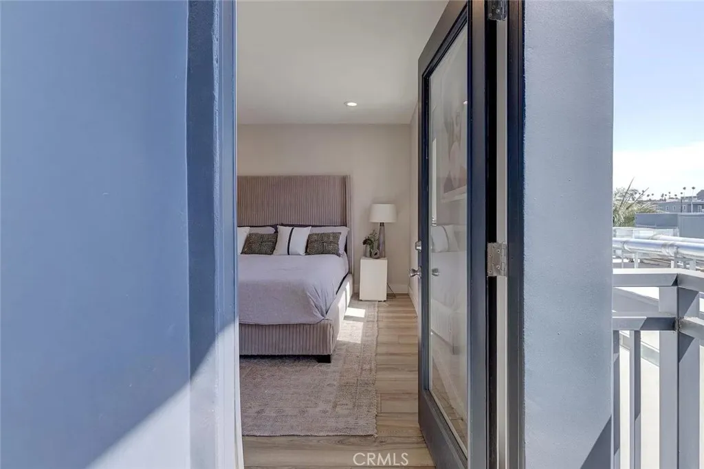 Top floor bedroom with balcony.