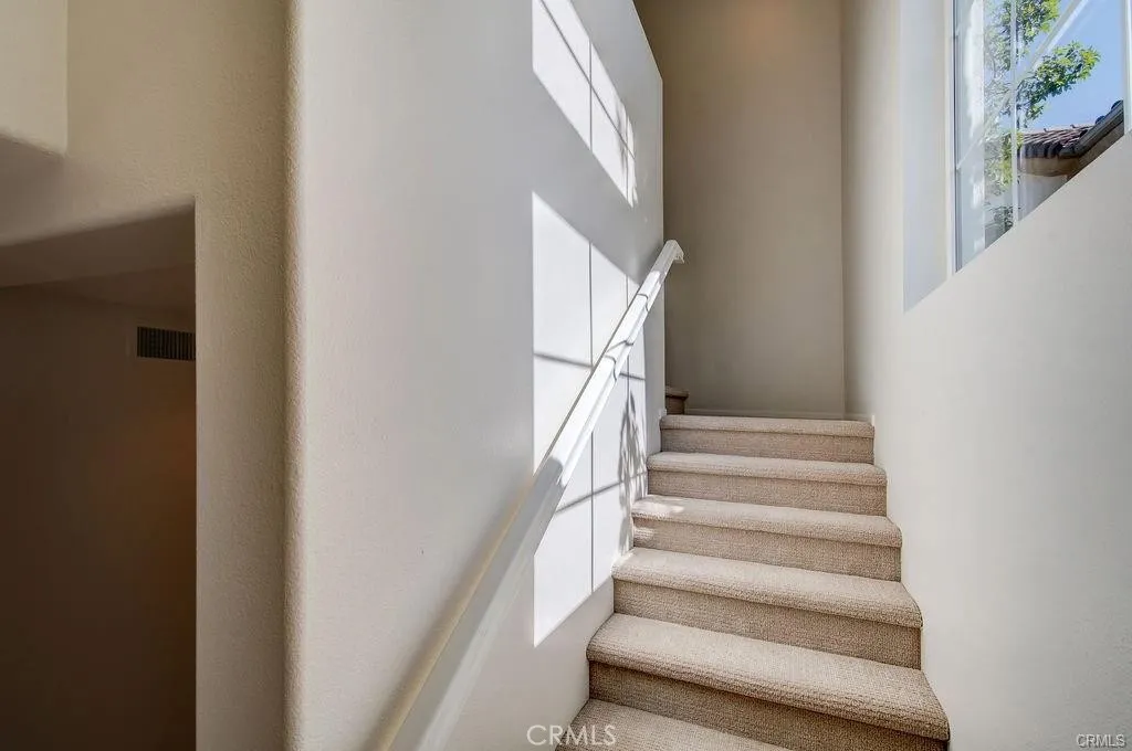 low pile carpeting on the stairway and in the bedrooms