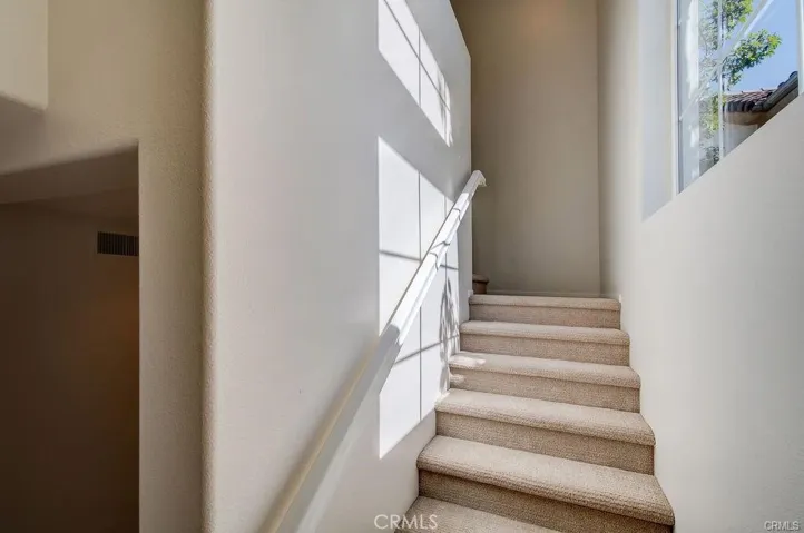 low pile carpeting on the stairway and in the bedrooms