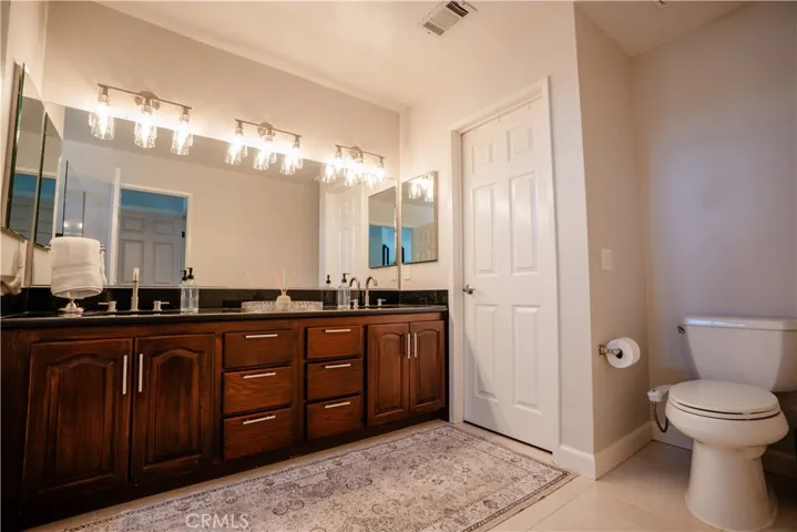 Primary Bathroom with walk-in closet